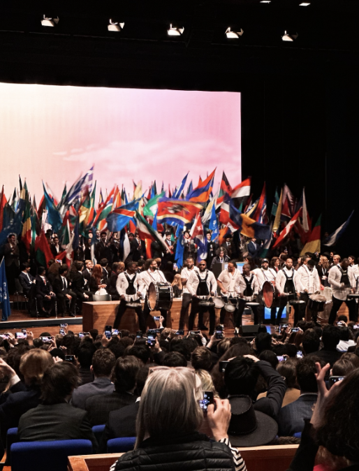 Image+from+the+closing+ceremony.+Ambassadors+from+each+school+wave+the+flag+of+the+country+they+represented+in+committee.